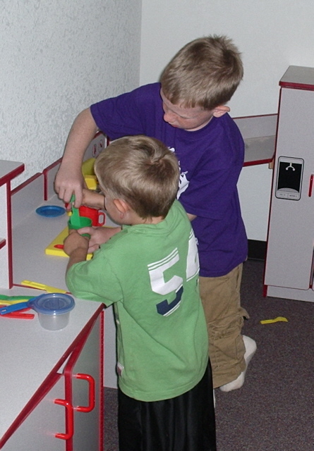 T & C playing in Day Care.JPG